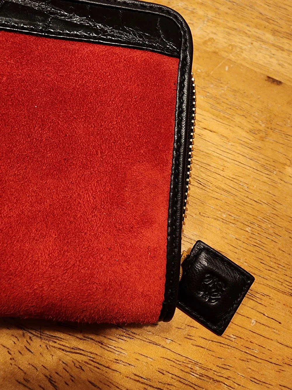 Loewe wallet features  vibrant red suede body & black crocodile Embossed Leather